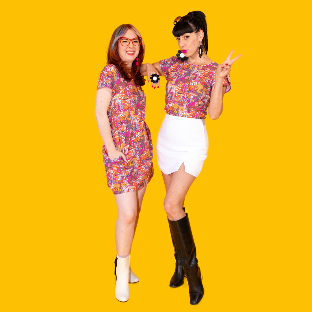 2 fun mdels posing in mushroom print clothing