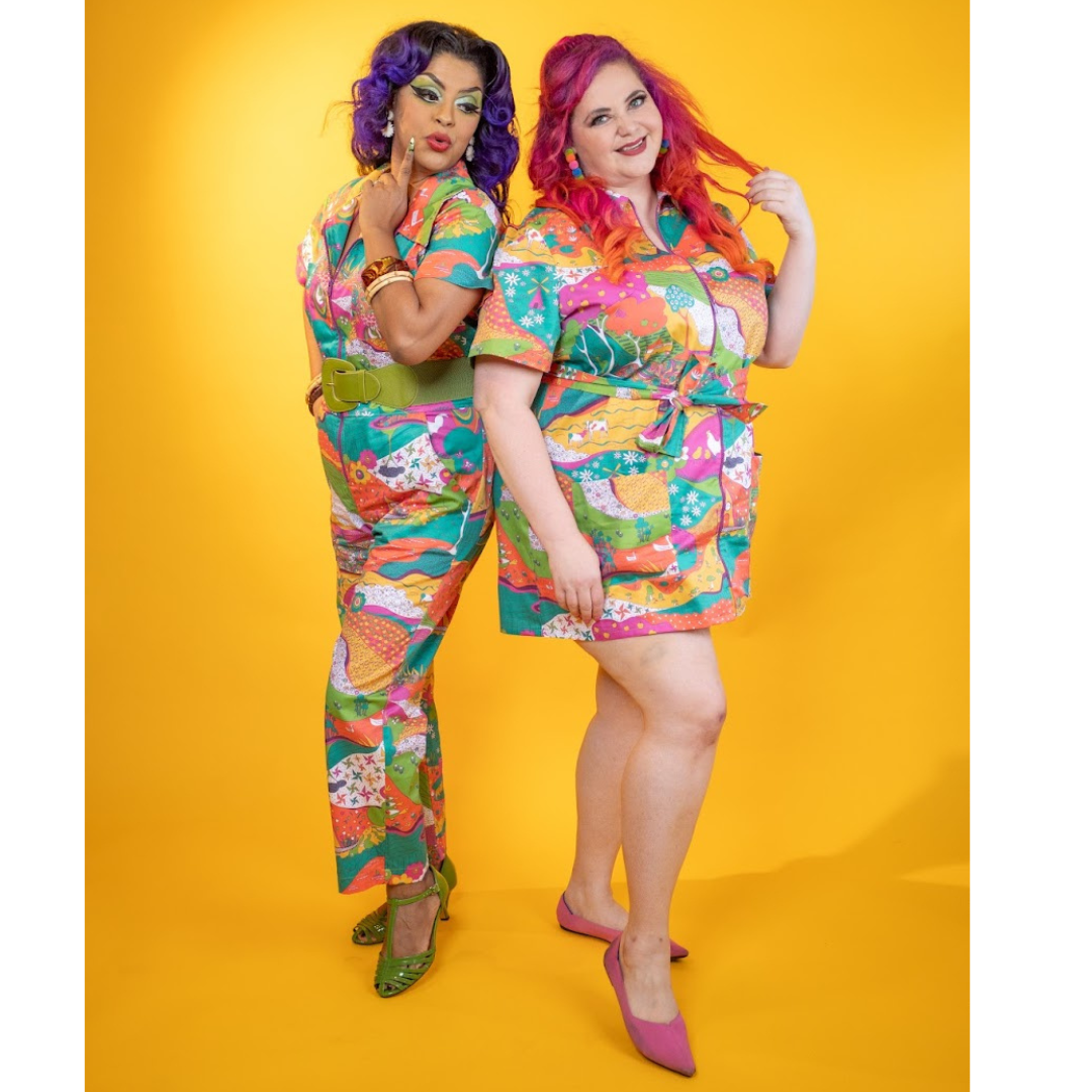 Full body of 2 models dressed in bright patterned clothing