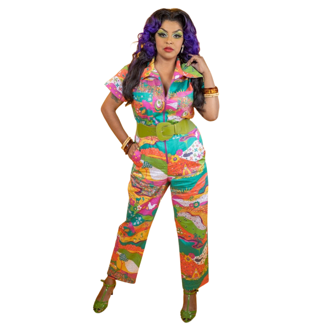 Pretty model with purple hair posing in colorful zip-front collared jumpsuit