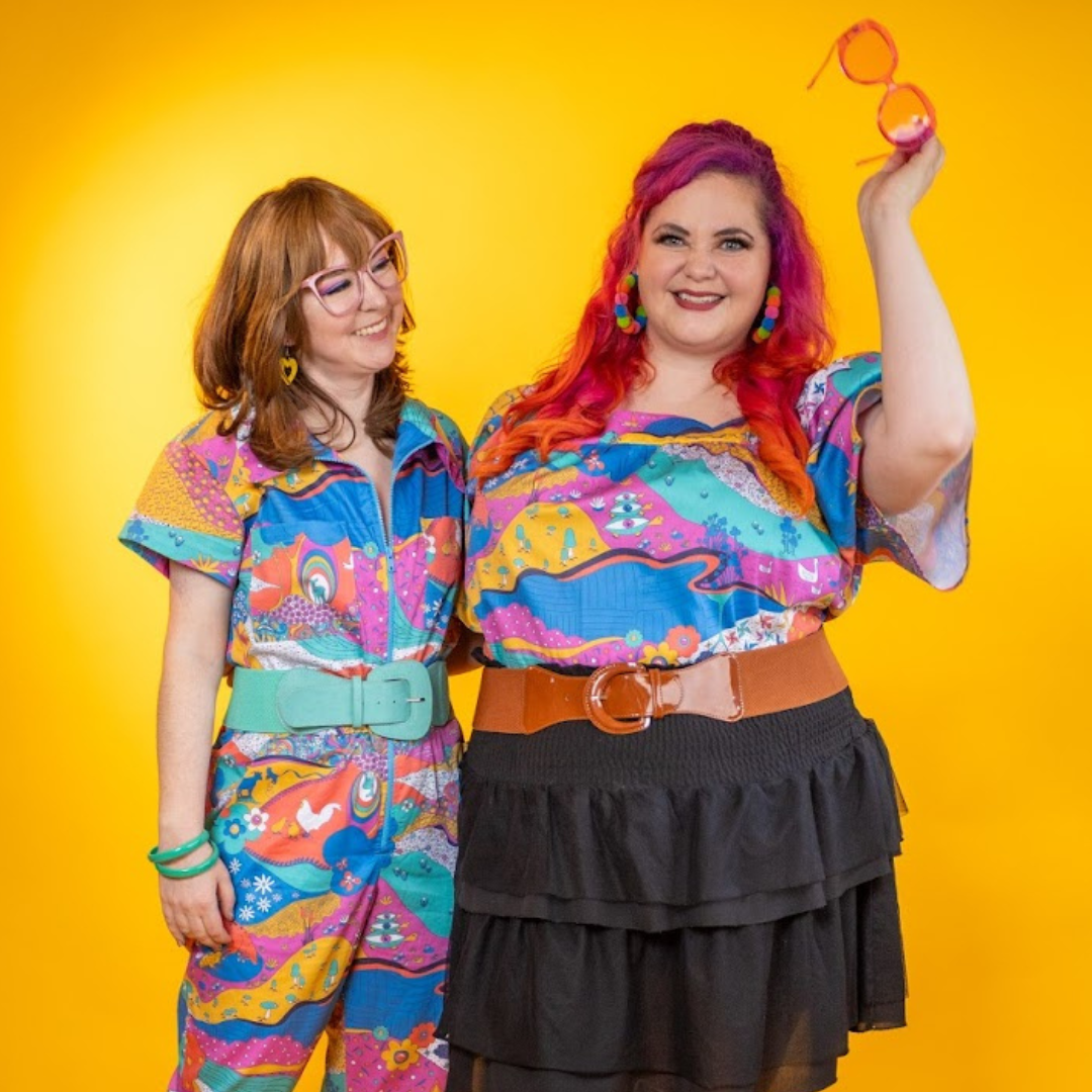 2 cute models in bright colorful clothing and large belts