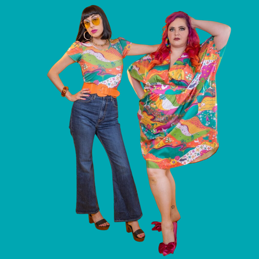 Black-haired model in colorful tunic and pink-haired model in bright caftan