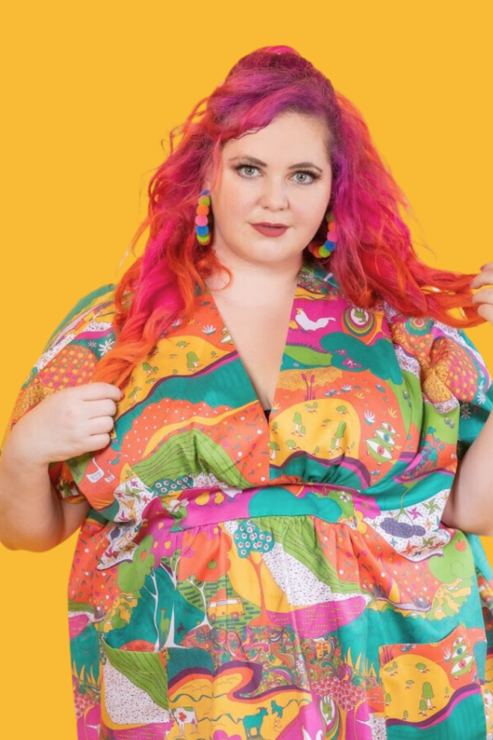 Pink-haired model in bright , colorful caftan