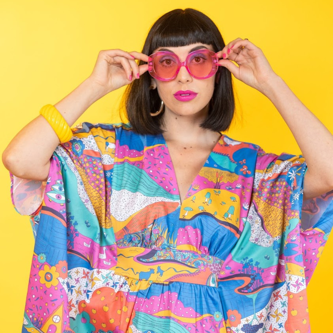 Closeup of model in bright, colorful caftan