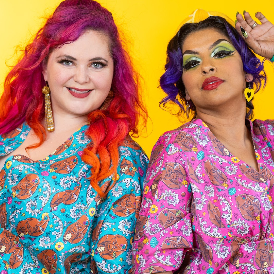 2 models in colorful monkey print caftans