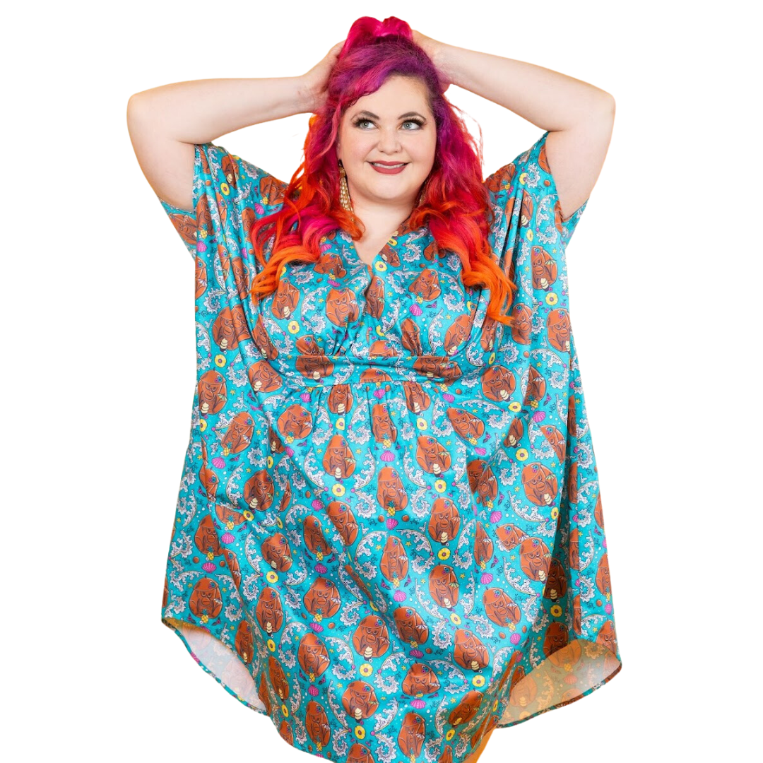 Model in teal midi monkey and pineapple print caftan