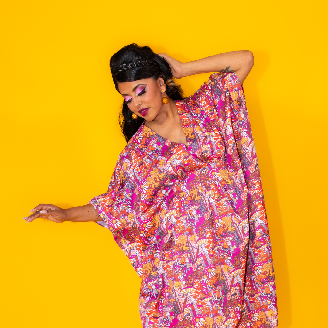 Latina model in bright mushroom print long caftan