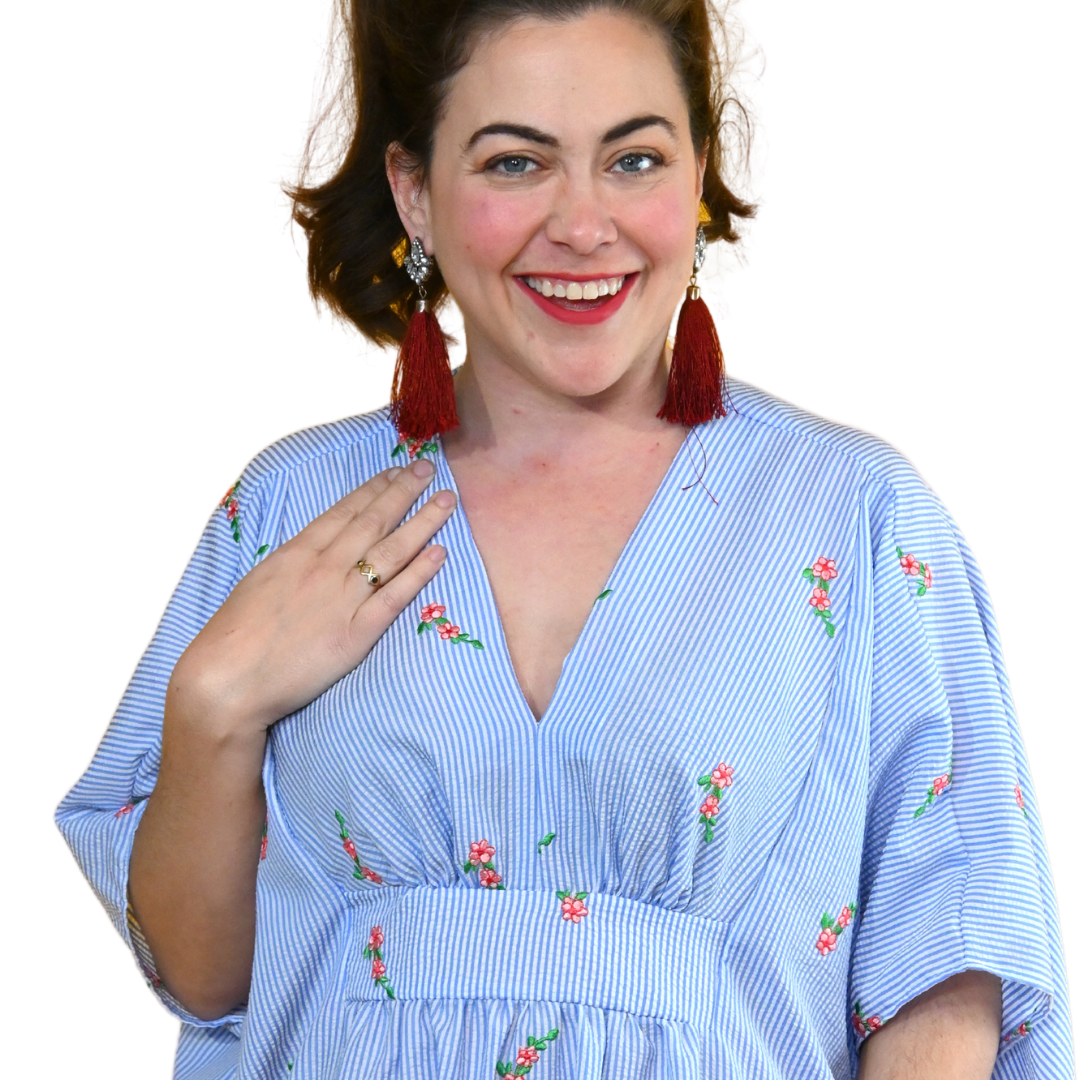 Closeup of brown-haired model in seersucker caftan