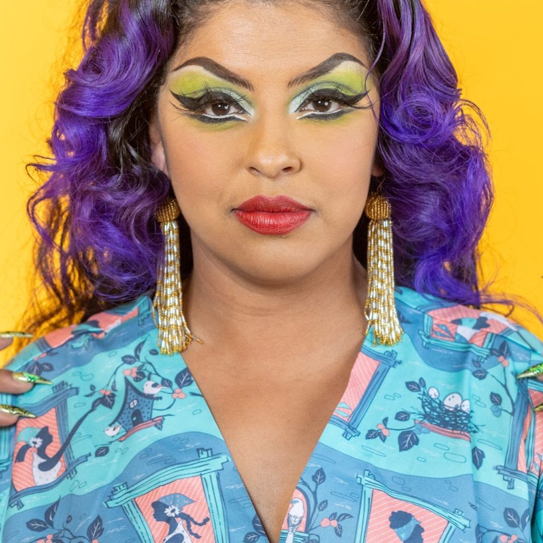 Closeup of model in caftan with bird and lady print