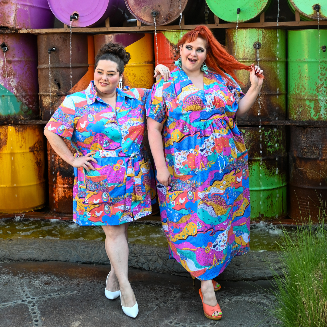2 pretty models in colorful landscape print clothing
