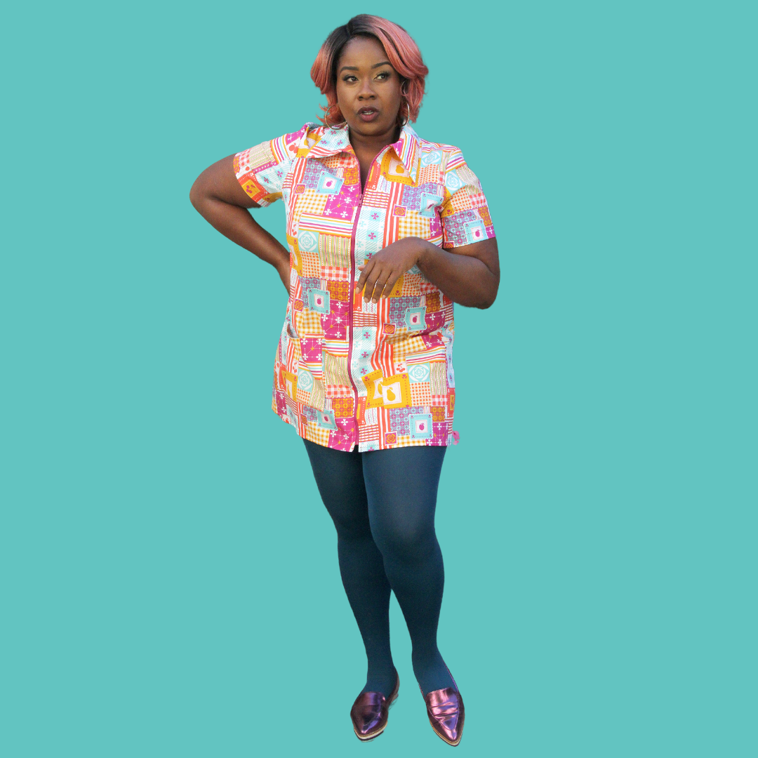 Full body pic of model wearing collared multicolor minidress