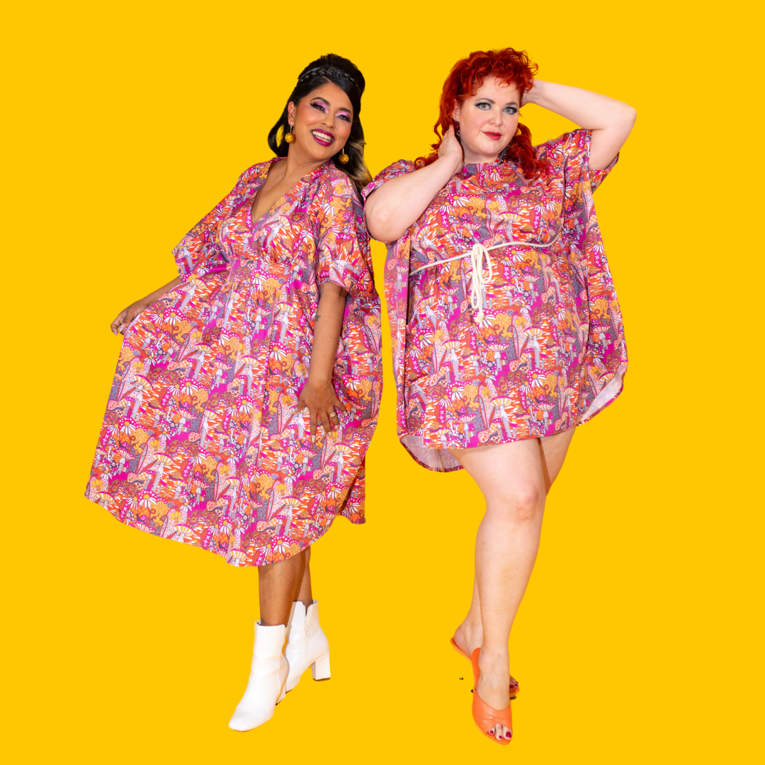 2 models posing in mushroom print dresses