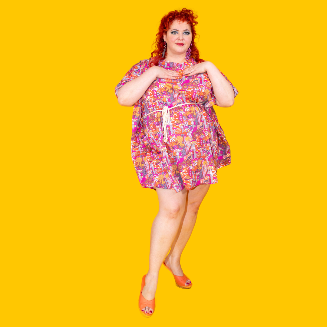 Full body view of model in mushroom print mini muumuu
