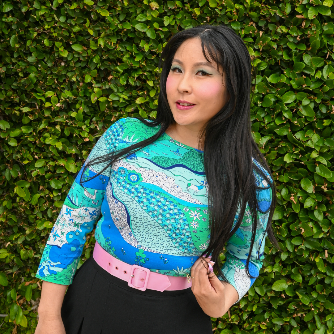 Closeup of Asian model in blue and green landscape print 3/4 sleeve cotton tee