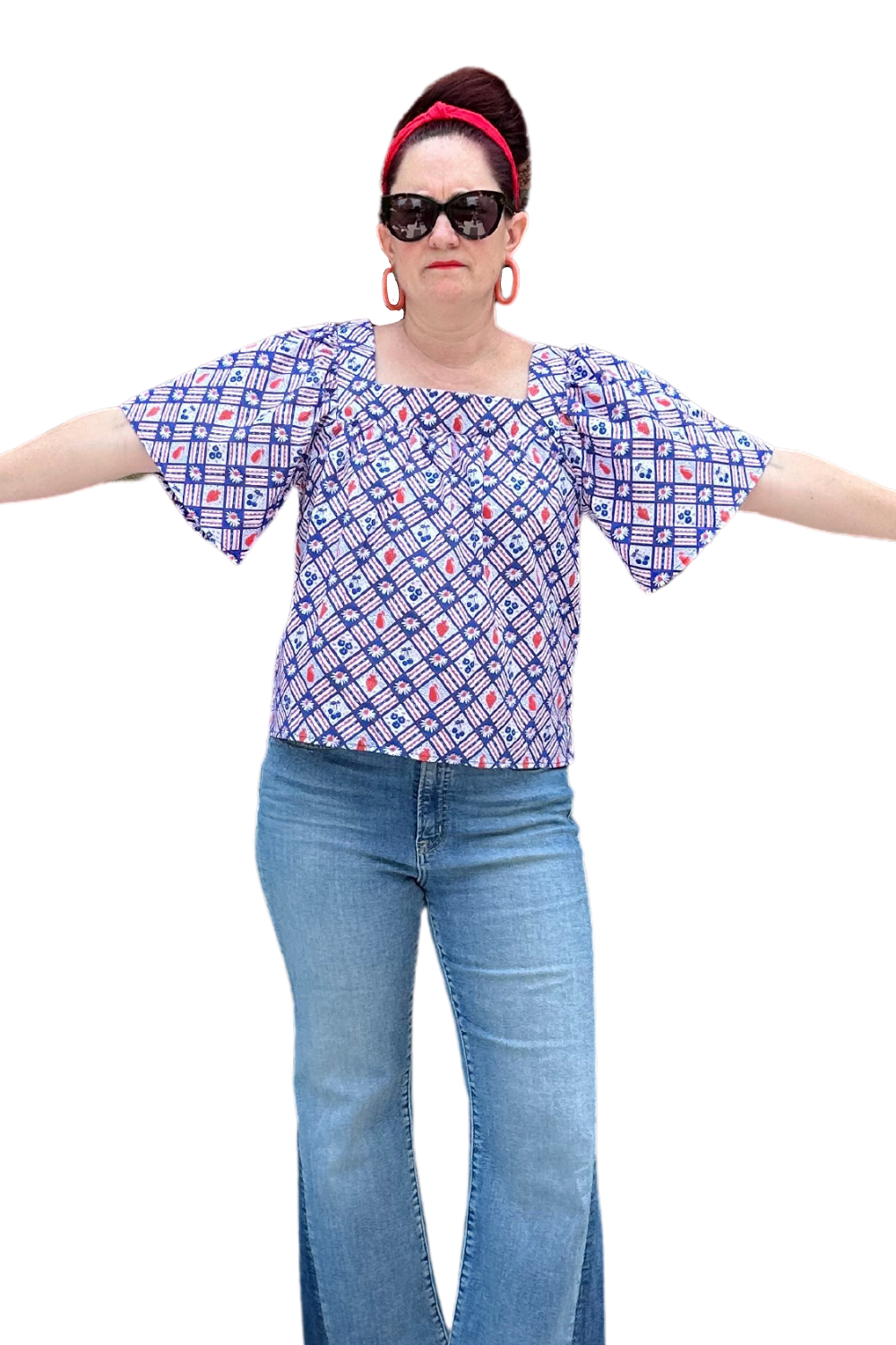 Square neck peasant top with blue and red print and graphic of fruit and flowers