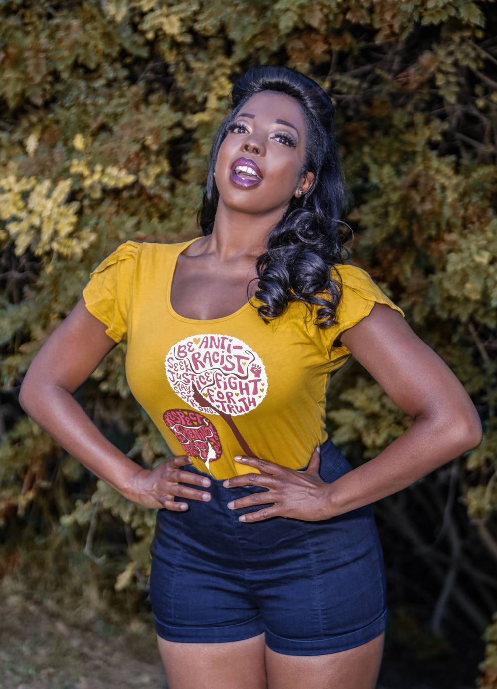 Yellow tee with anti-racist messages on gorgeous Black model