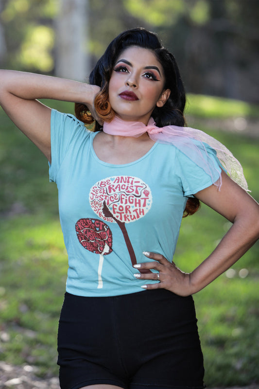 Latina model wearing blue shirt with anti-racist messages