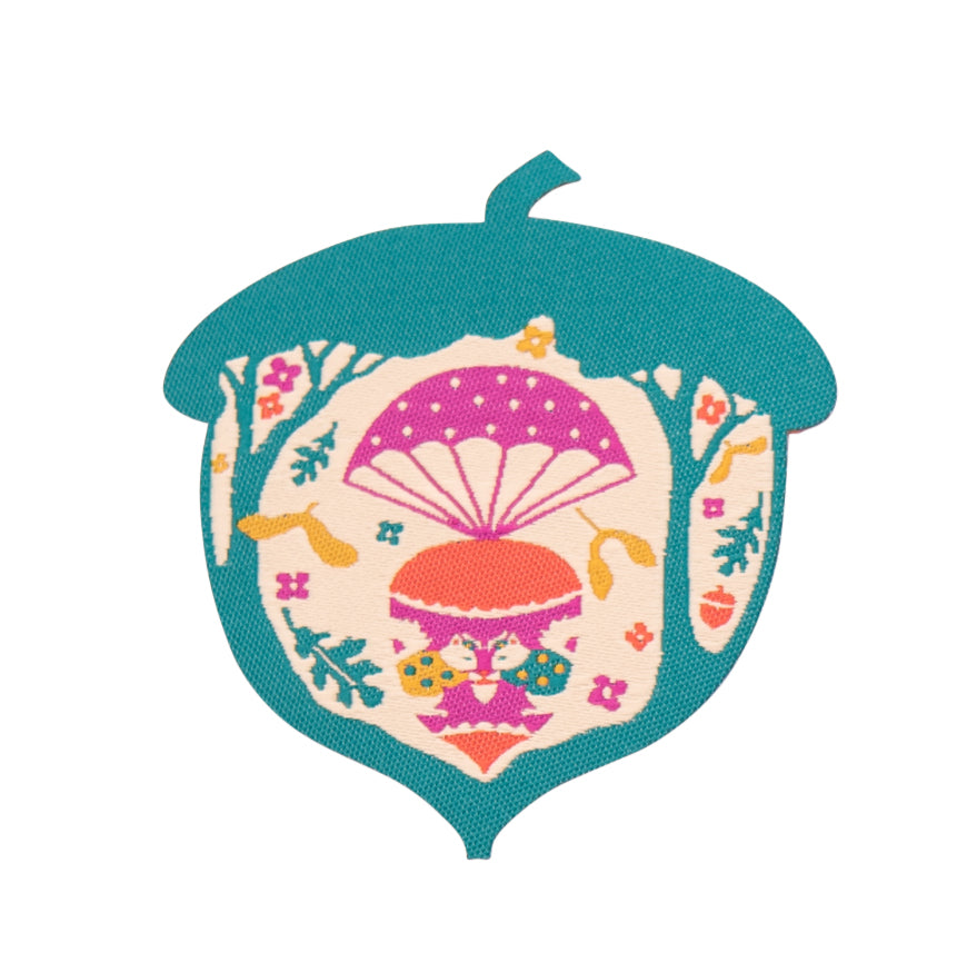 Bright green acorn-shaped iron on patch with parachuting squirrels and leaves