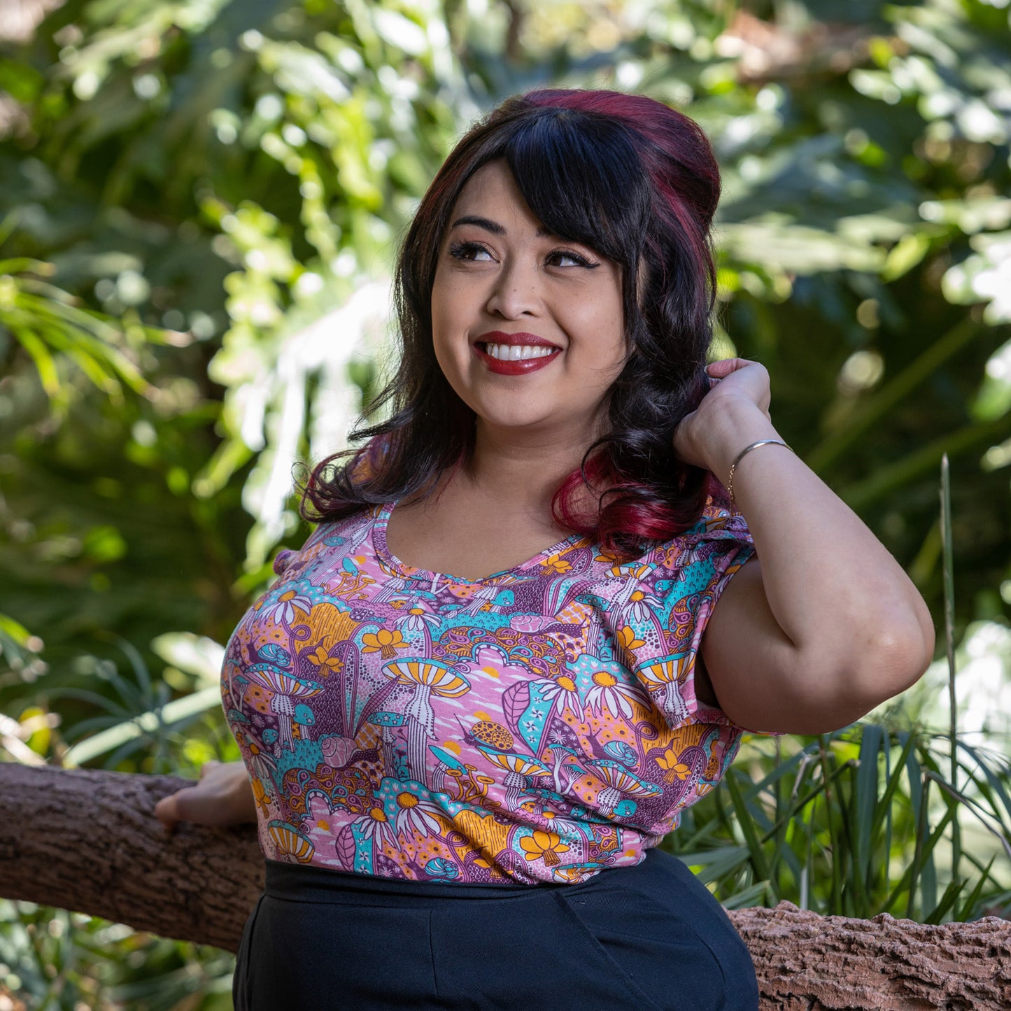 Pink mushroom, snail and flower print tulip-sleeved tee on Latina model