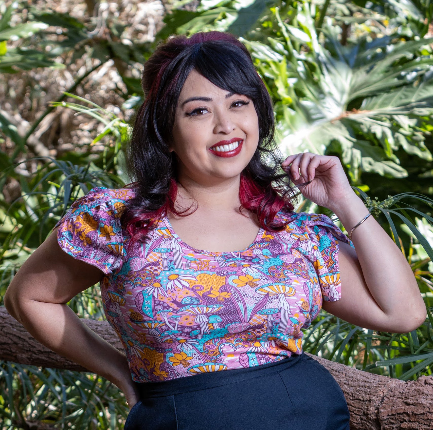 Pink mushroom, snail and flower print tulip-sleeved tee on Latina model
