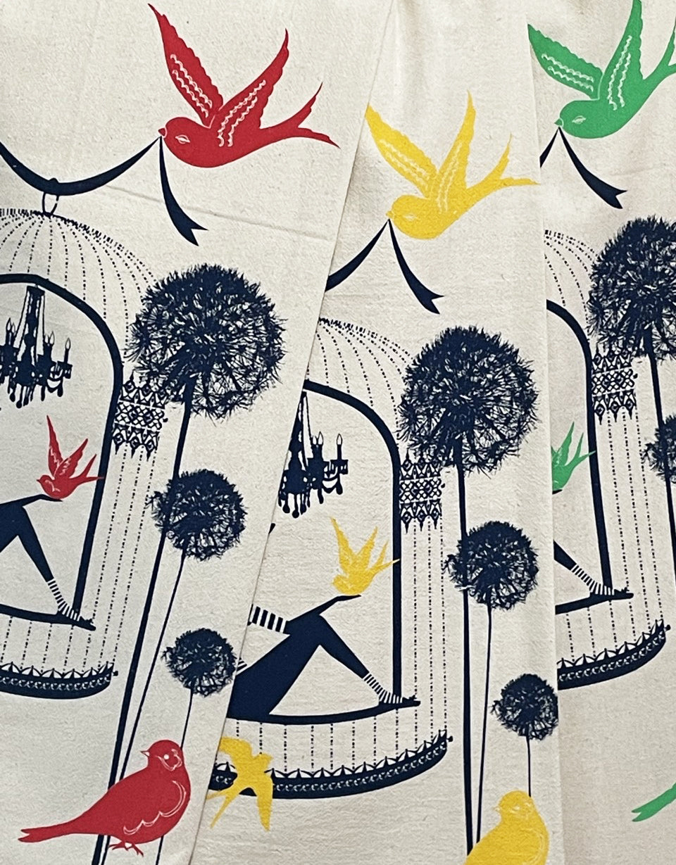 3 colorful cotton tea towels with birds and a woman in a birdcage