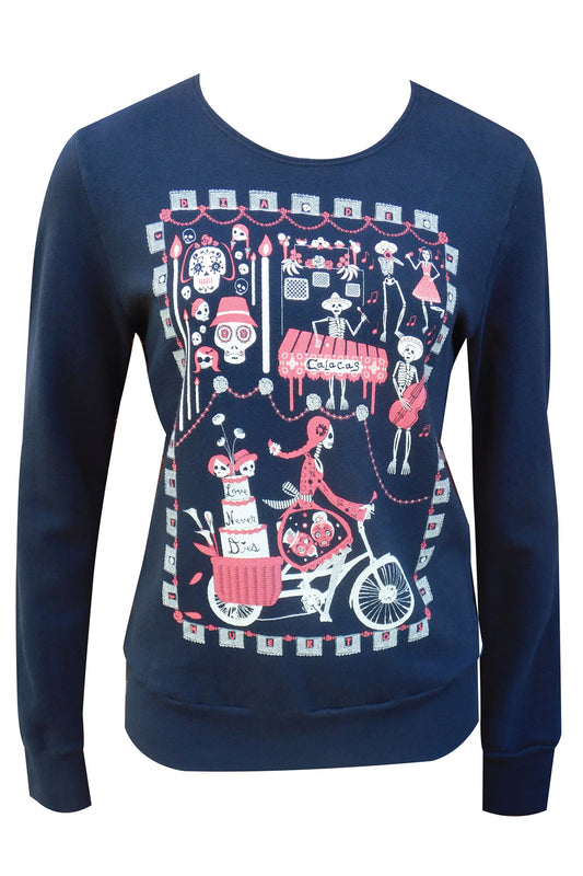 Closeup of fabric featuring graphic of skeletons celebrating and riding bikes