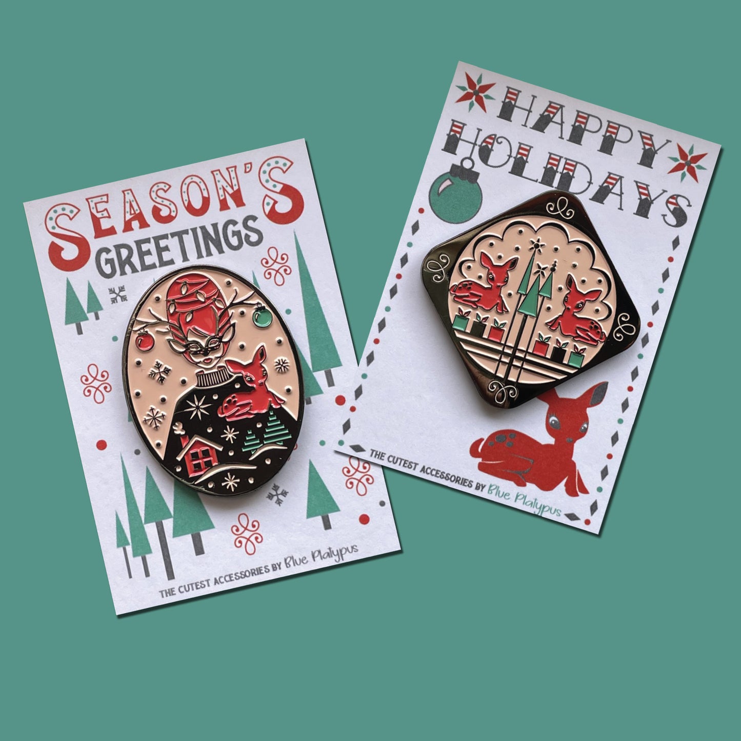 Two bright vintage inspired red and green enamel pins, one of masked woman with beehive hair and one with 2 reindeer
