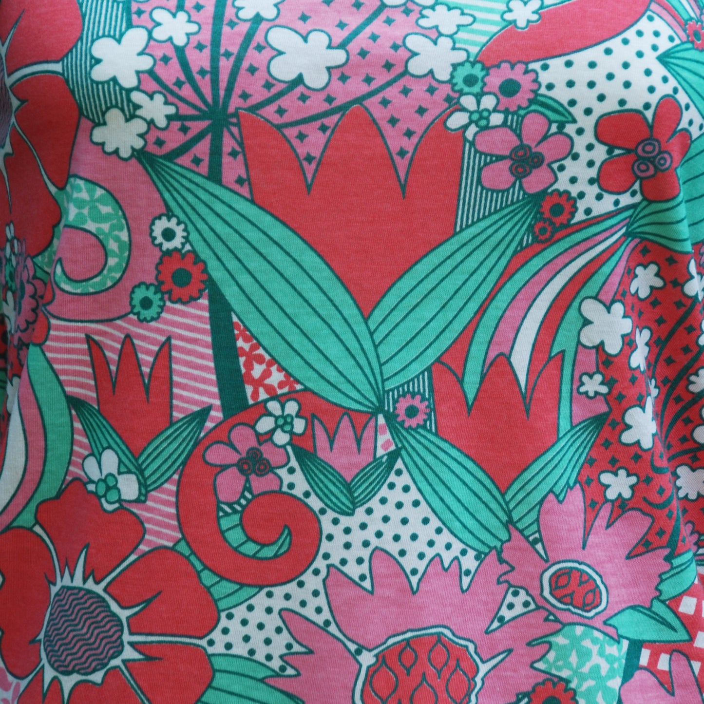 Closeup of big pink and green floral with tulips and daisies