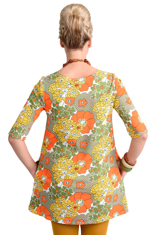 Back of pocket tunic in orange and olive with graphic of flowers