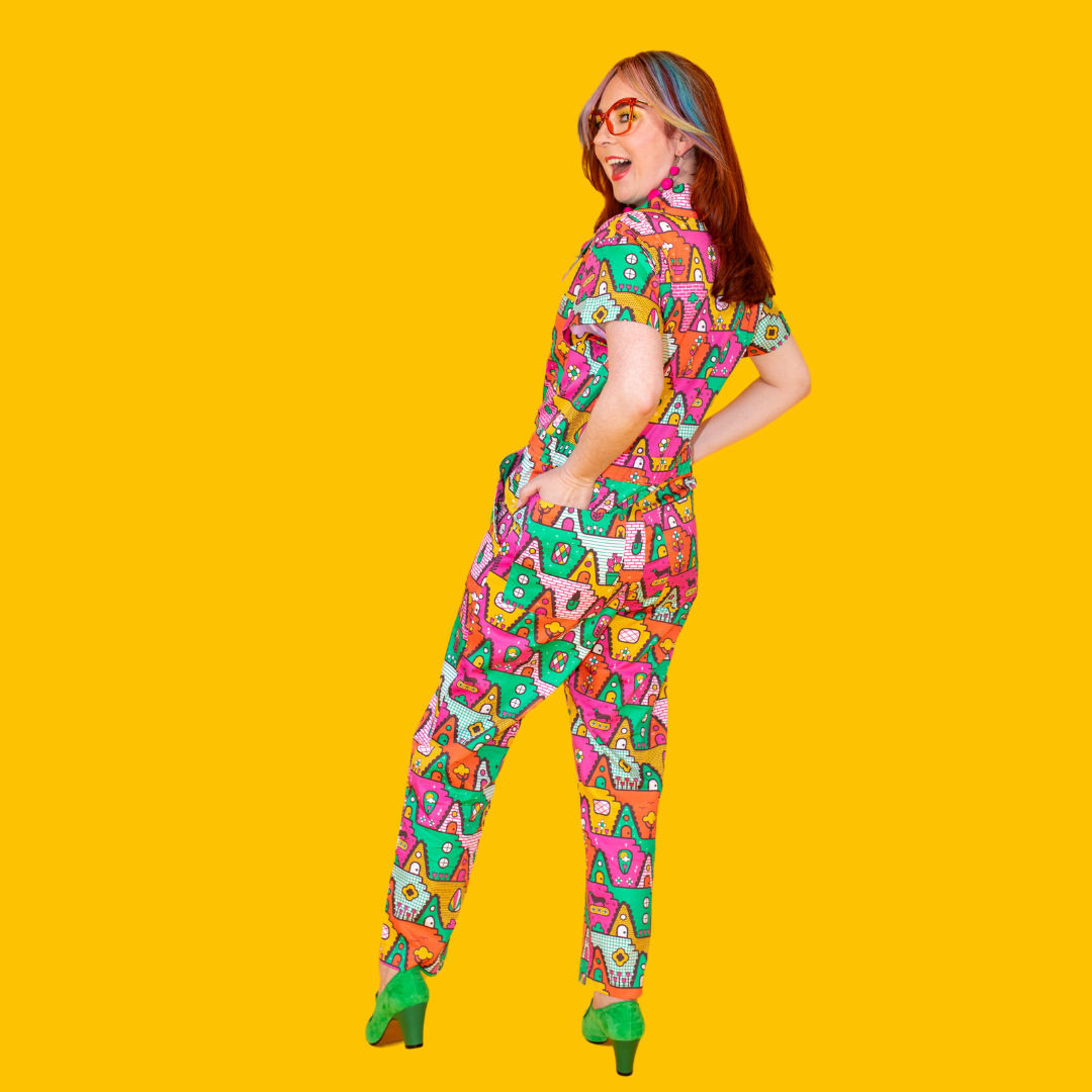 Back view of colorful geometric jumpsuit on slender model 