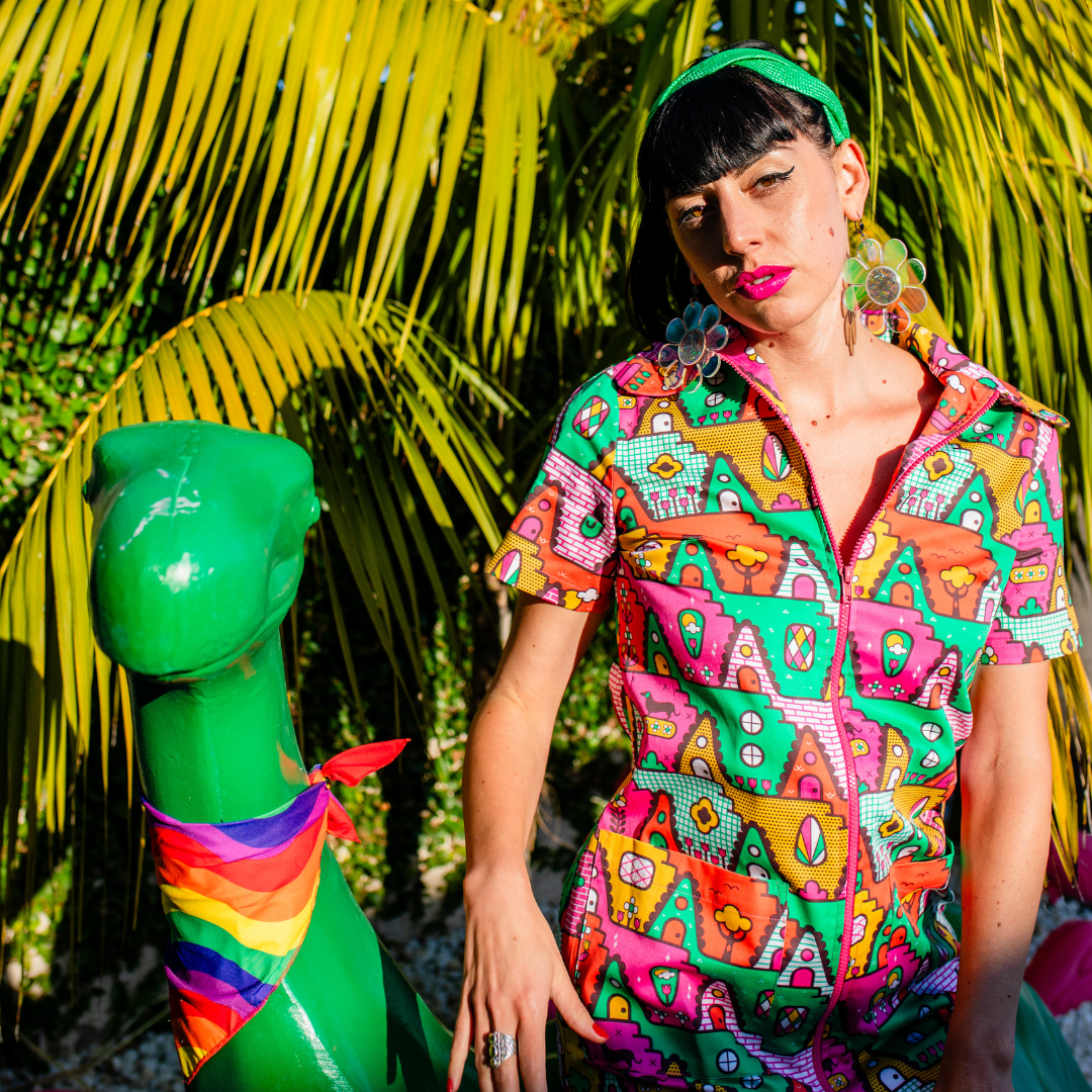 Cute girl with bright lipstick in bold, colorful geometric print clothing