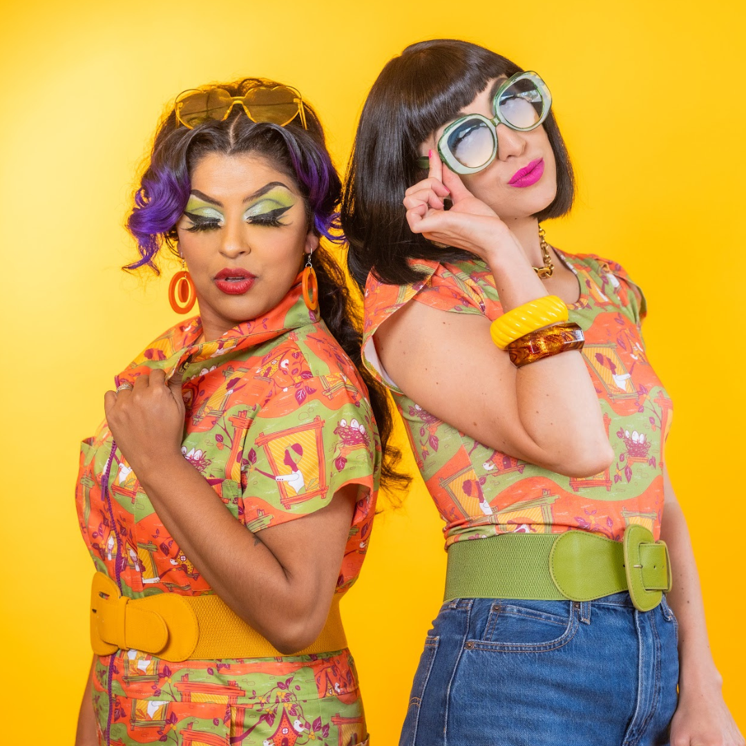 2 models wearing colorful printed clothing featuring girls in windows