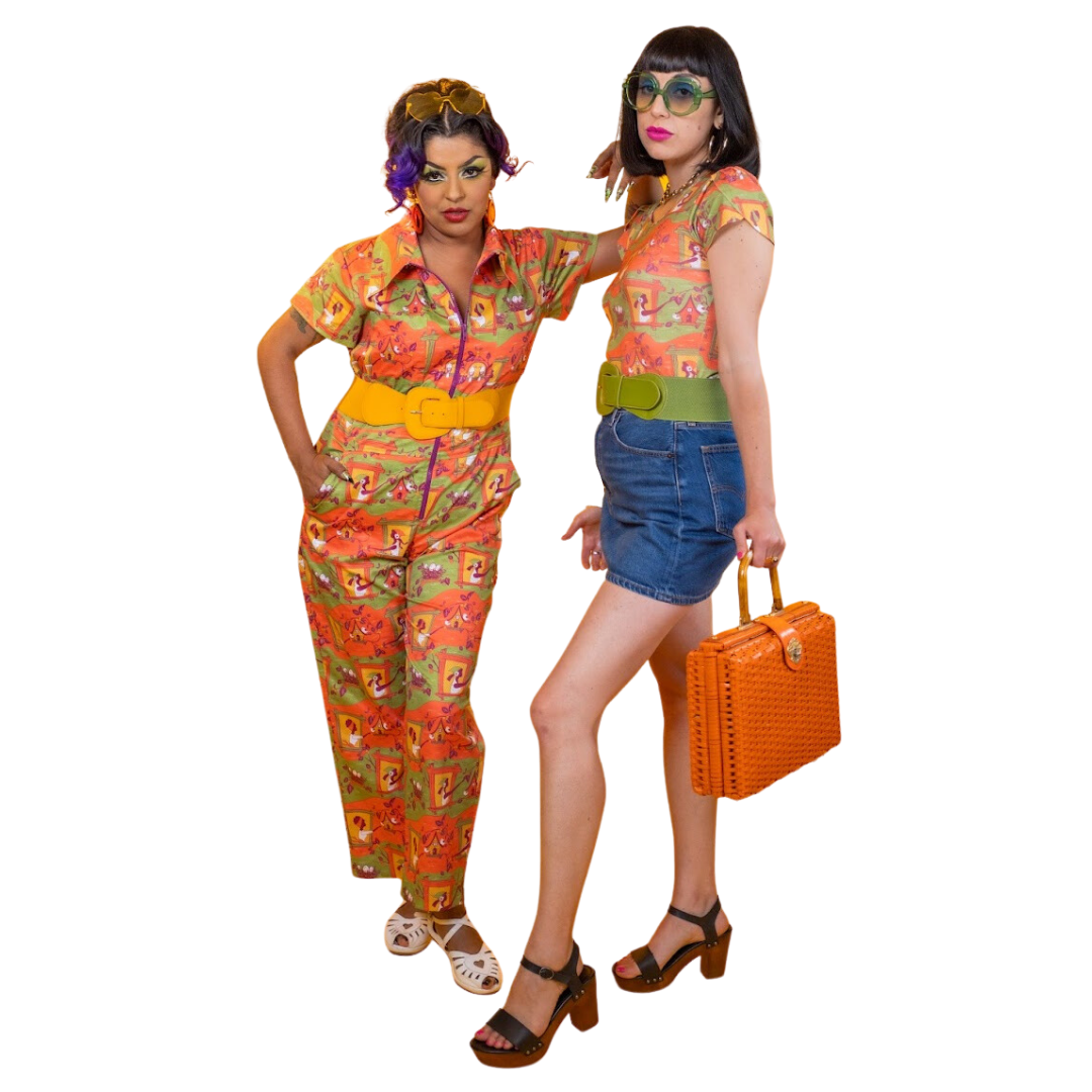 2 models wearing quirky orange and green outfits and fun accessories