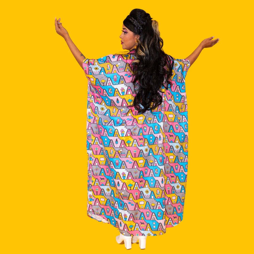 Back view of model in pink, yellow, blue cotton maxi caftan