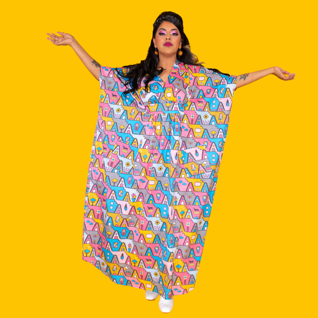 Pretty Latina model in pastel geometric print maxi caftan posing confidently