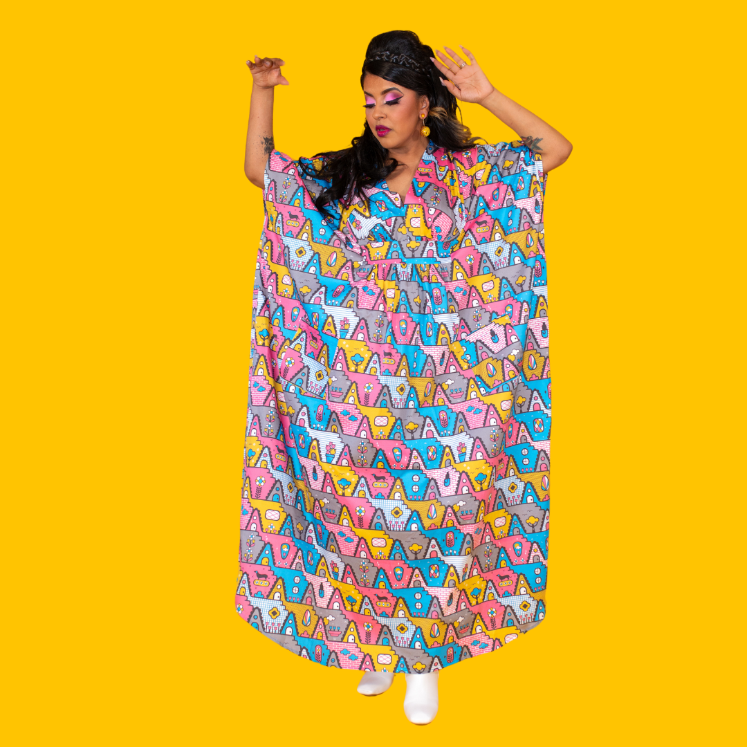 Pretty Latina model in pastel geometric print pink and blue maxi caftan