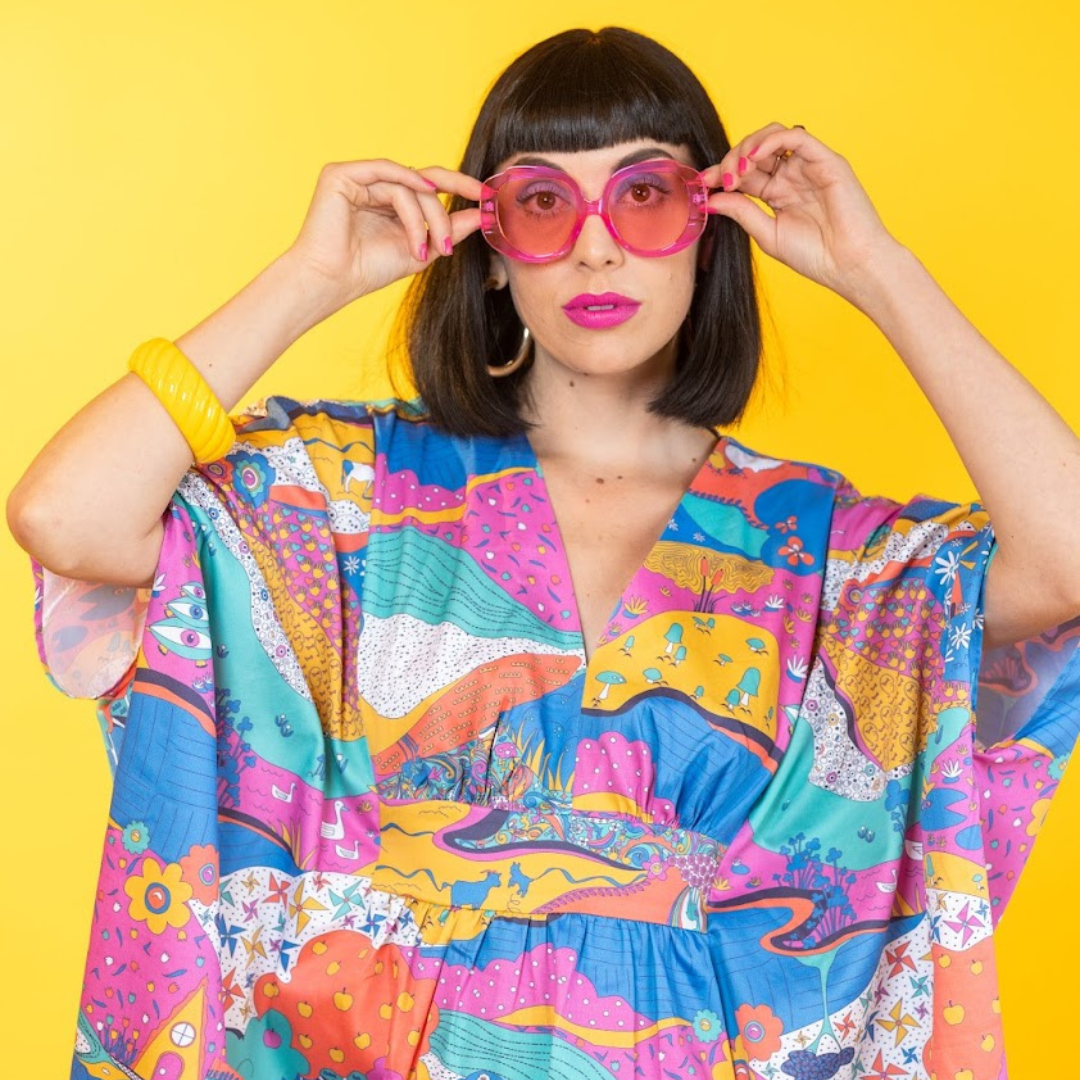 Closeup of model in bright, colorful caftan 