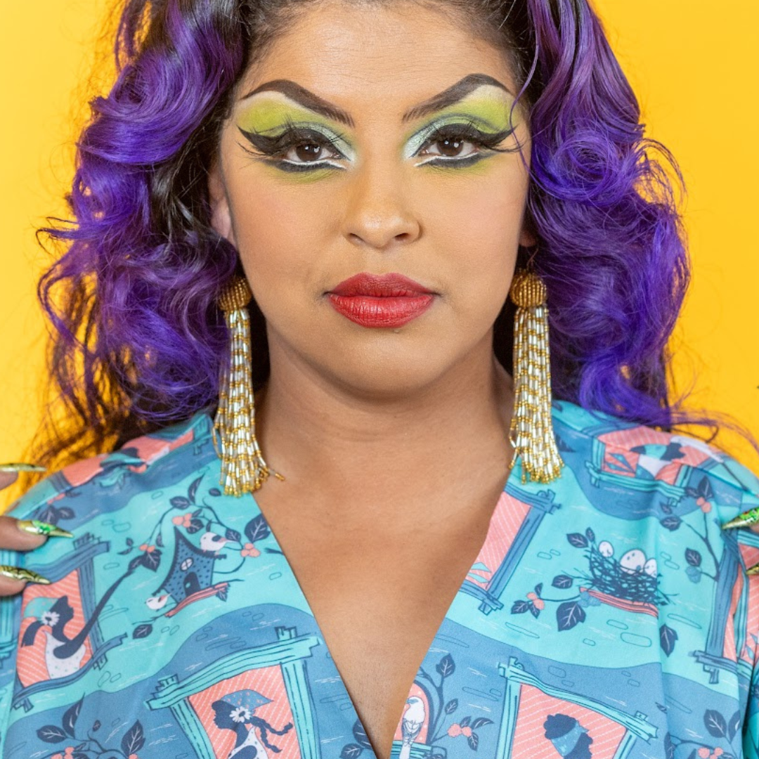 Closeup of model in caftan with bird and lady print 