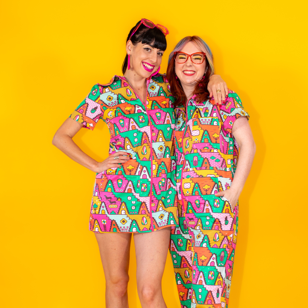 2 models wearing matching a-frame print outfits, a minidress and a jumpsuit