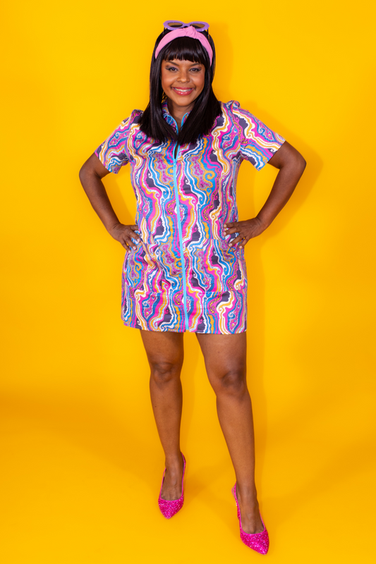 Pretty Black girl wearing bright psychedelic print minidress 