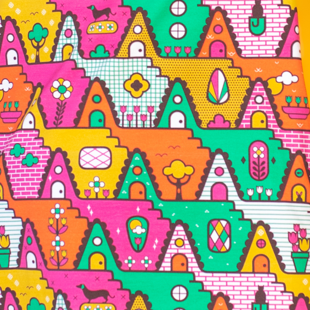Closeup of a-frame print in bright day color combo of orange, yellow, pink and green