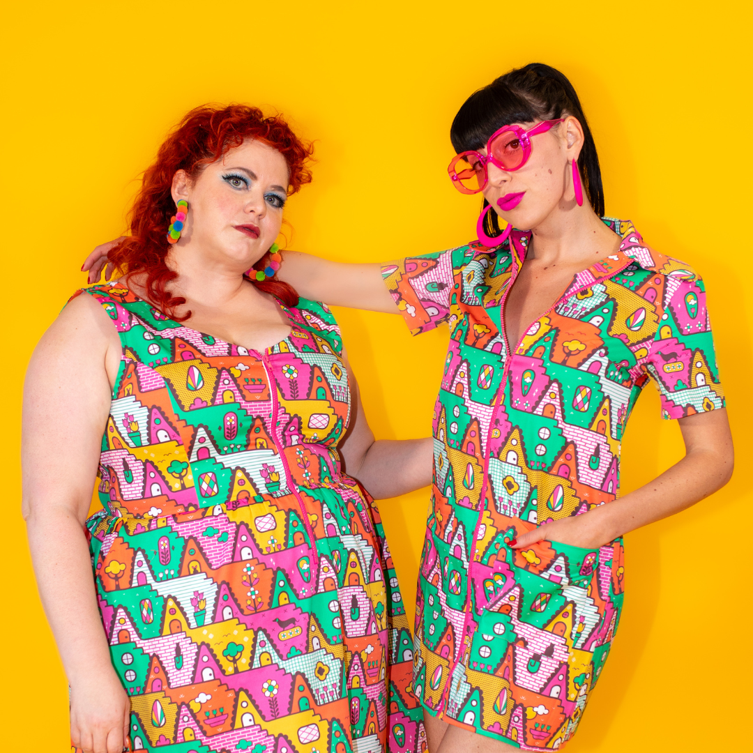 2 models wearing coordinating dresses with matching geometric prints