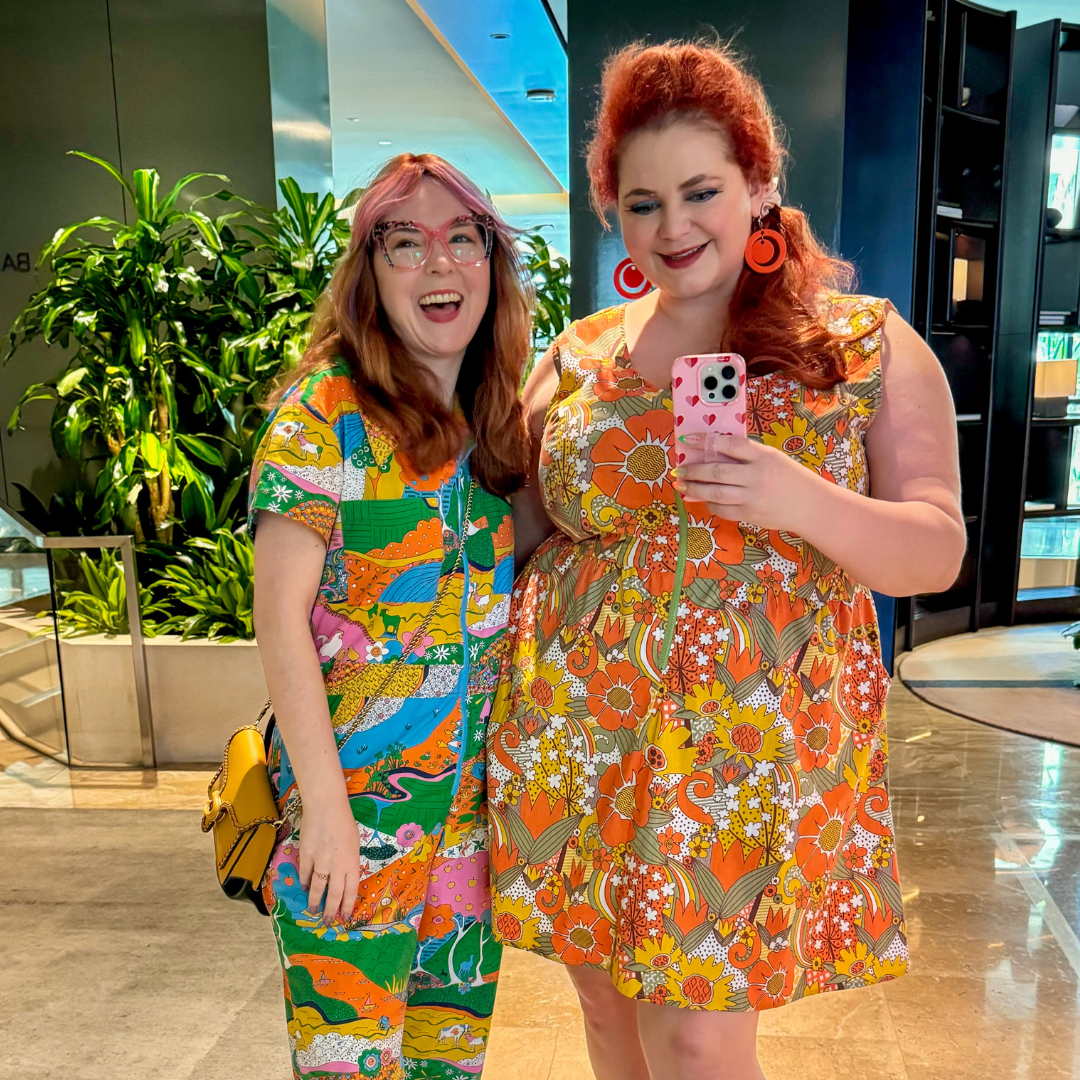 2 cute models in colorful outfits in the mall