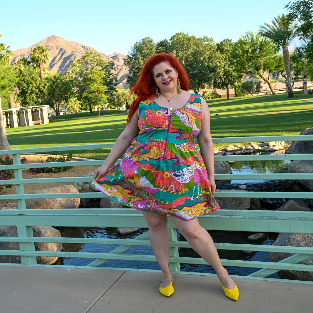 Red-haired model in bold, fun, colorful zip-front cotton sundress