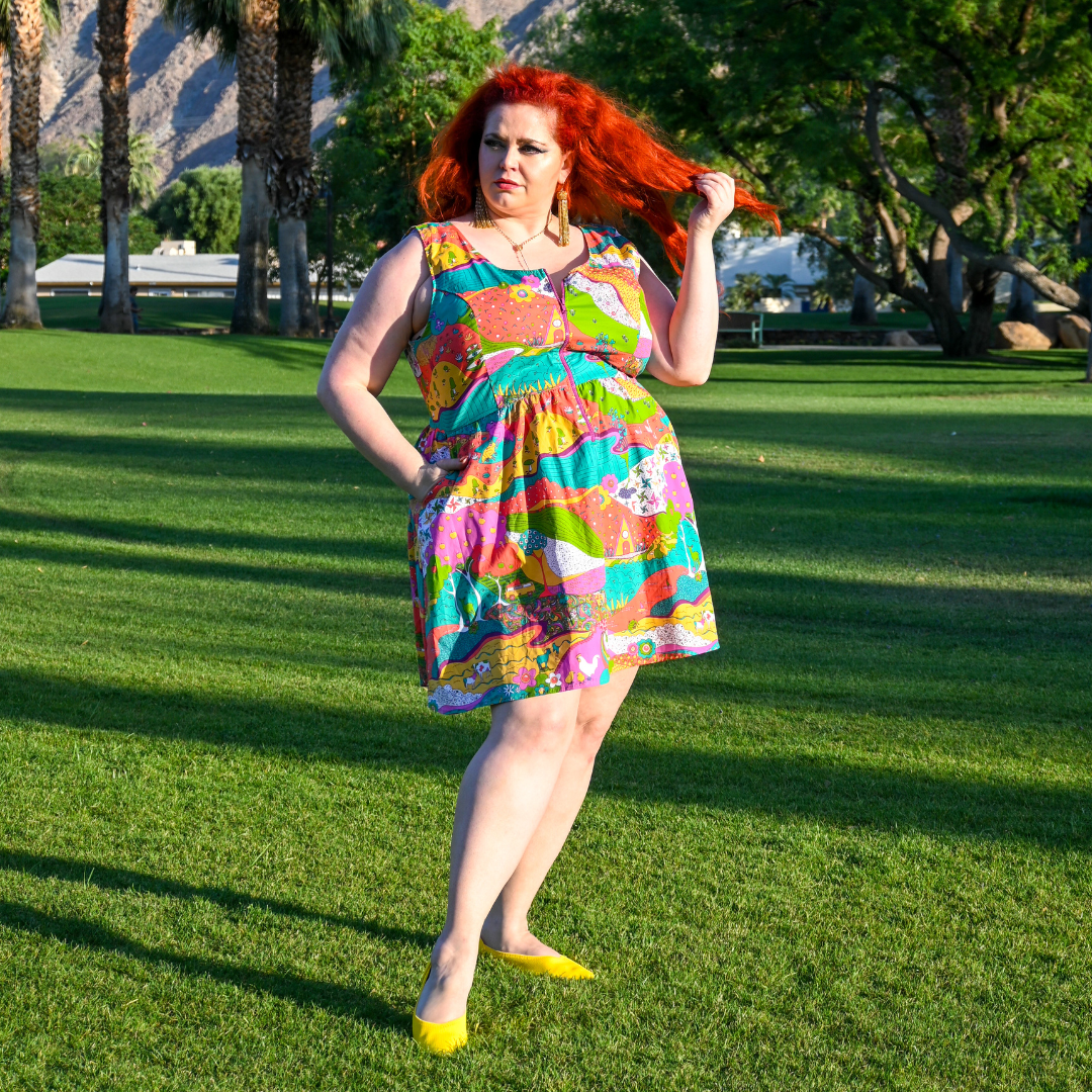 Model posing in pretty sundress  in the sunshine