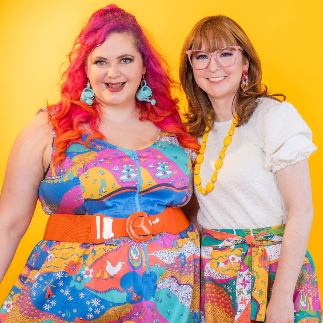 Closeup of 2 models in colorful, retro print clothing