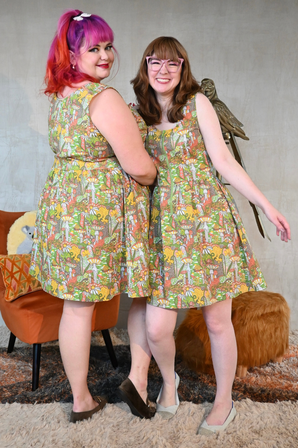 Front and back view of models in olive mushroom print fit & flare dress
