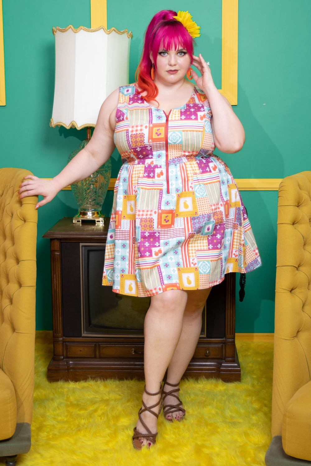 Model wearing colorful dress with a patchwork design