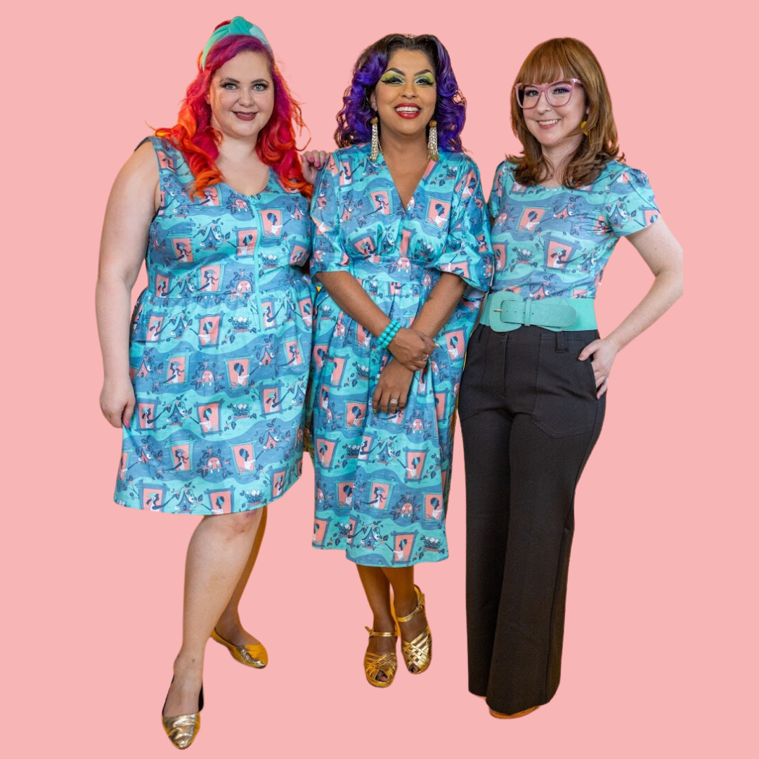 3 girls in matching peach, aqua and grey clothing featuring vintage girls feeding birds 