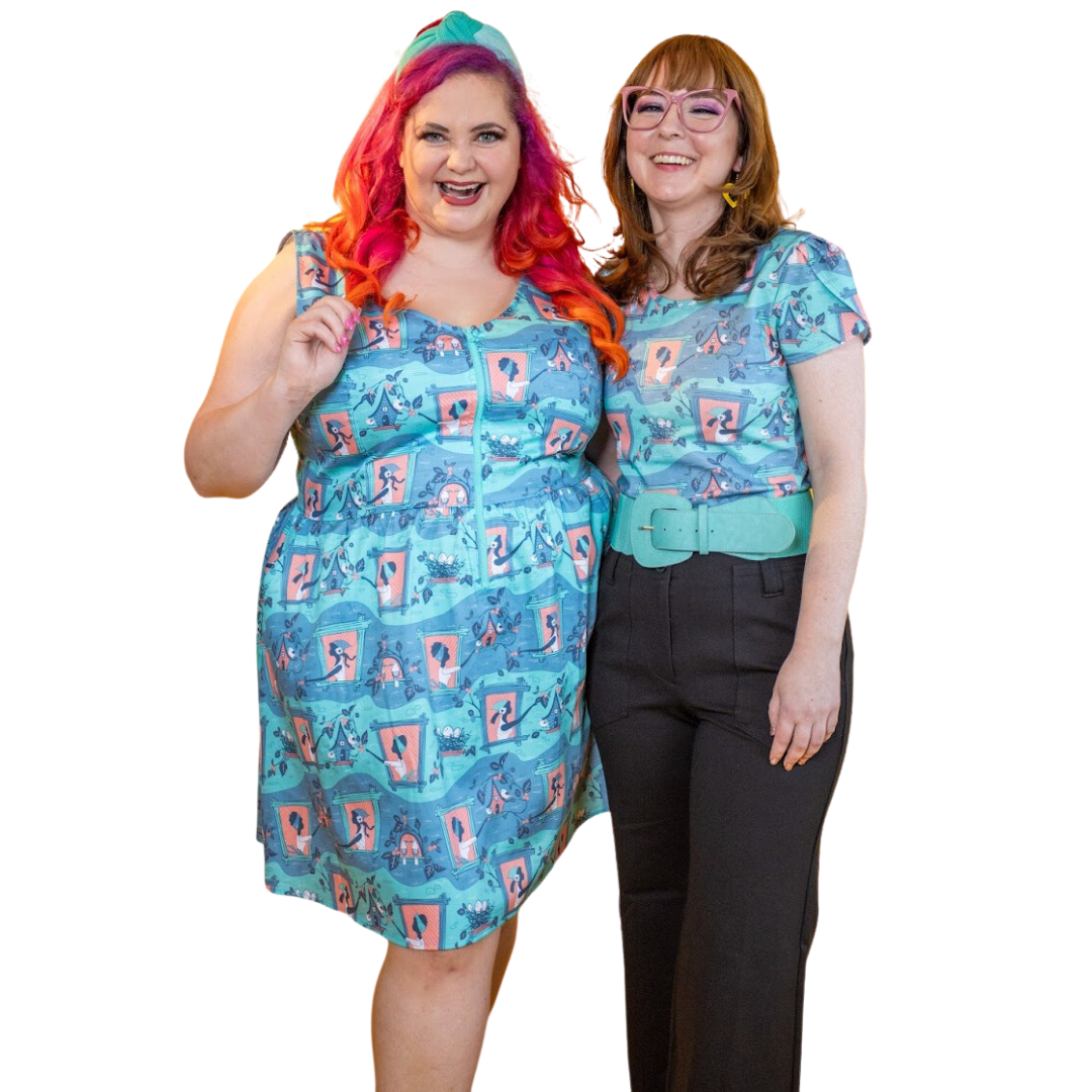 2 models in cute mint and peach clothes featuring a darling print of girls in windows