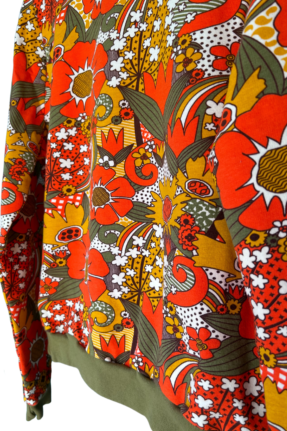 Cropped Floral French terry sweatshirt in orange and olive floral print, hanging